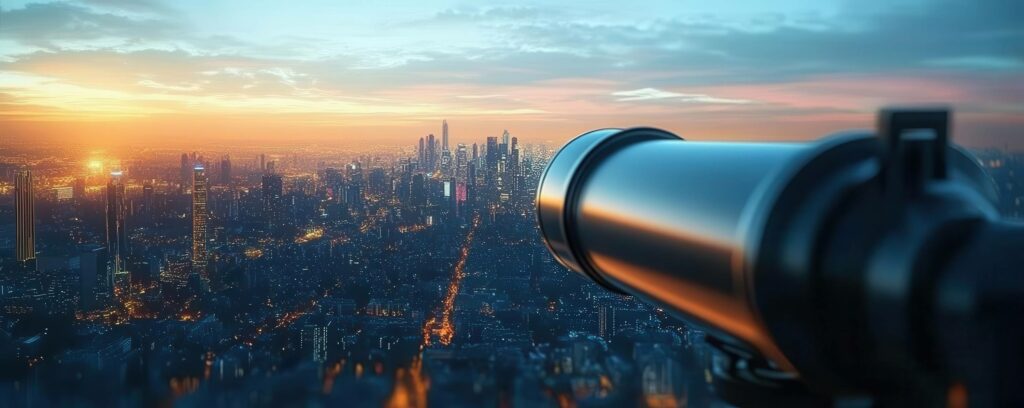 Objectif photo au premier plan avec une ville en arrière-plan, représentant la vision claire et structurée d’une société : ses objectifs, ses services, ses clients et sa philosophie.